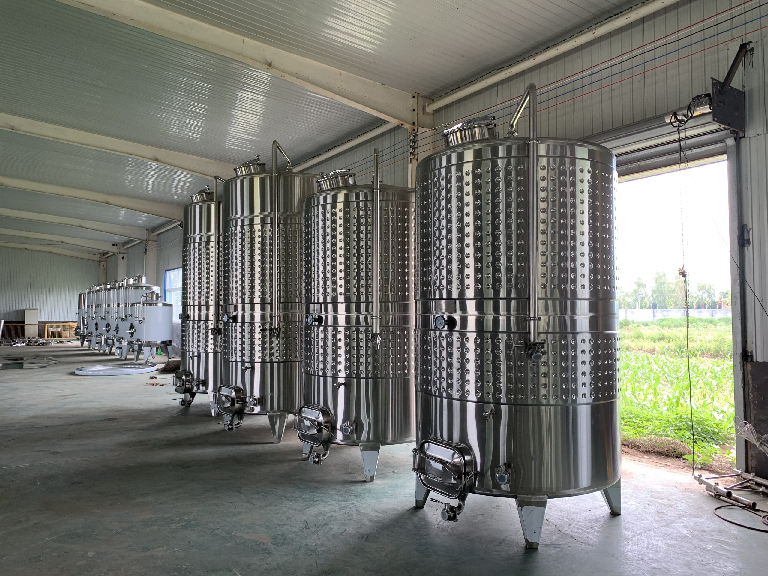 Cylindrical wine fermentation tanks 